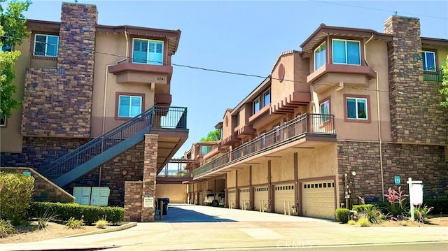 5241 Colodny Dr Unit 403, Agoura Hills, CA 91301 - view of property with an attached garage and driveway