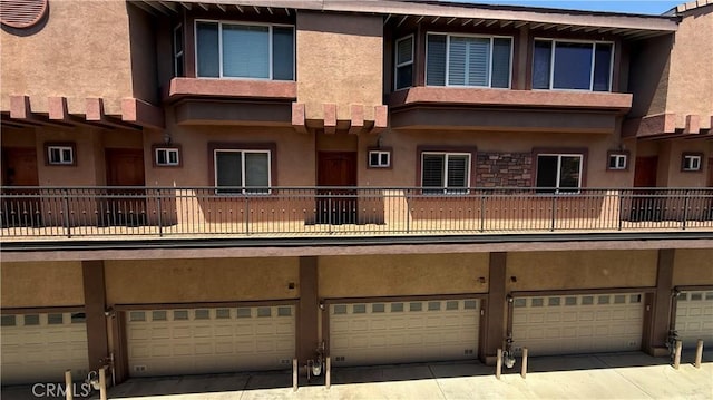 5241 Colodny Dr Unit 403, Agoura Hills, CA 91301 - view of property featuring a garage and driveway
