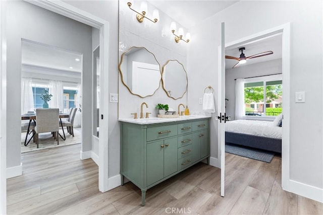 4400 Homer St, Los Angeles, CA 90031 - ensuite bathroom featuring double vanity, a ceiling fan, and wood finished floors