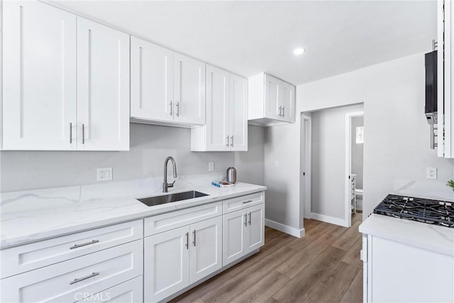 4400 Homer St, Los Angeles, CA 90031 - kitchen with white cabinets, light stone counters, light wood-style floors, and recessed lighting