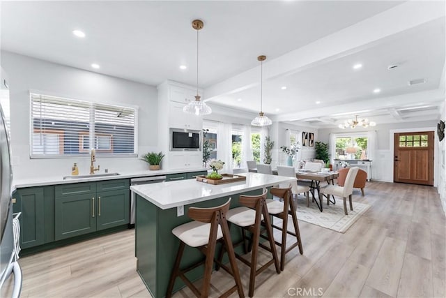4400 Homer St, Los Angeles, CA 90031 - kitchen featuring green cabinets, appliances with stainless steel finishes, recessed lighting, light countertops, and a kitchen island
