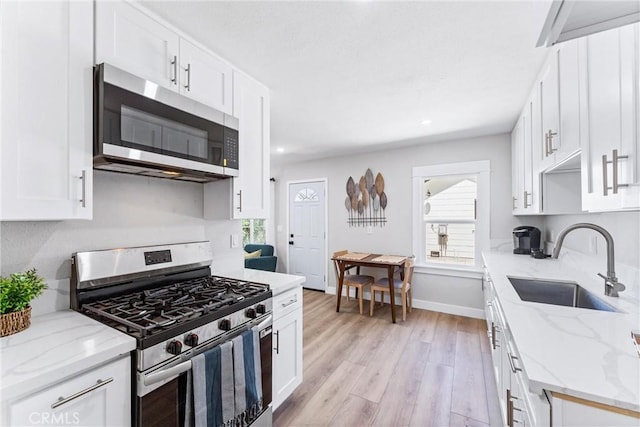 4400 Homer St, Los Angeles, CA 90031 - kitchen featuring stainless steel appliances, plenty of natural light, white cabinetry, light wood-style flooring, and recessed lighting