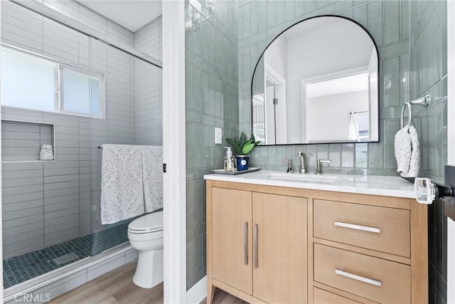 4400 Homer St, Los Angeles, CA 90031 - bathroom featuring vanity, a stall shower, tile walls, and wood finished floors