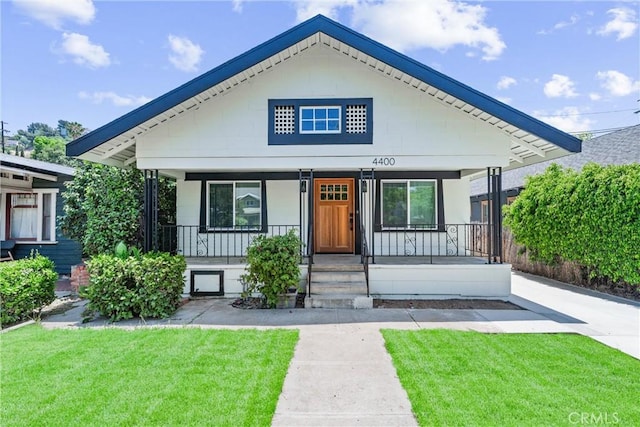 4400 Homer St, Los Angeles, CA 90031 - view of front of house with covered porch and a front yard