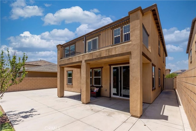 4733 S Rogers Way, Ontario, CA 91762 - rear view of house featuring a patio area, stucco siding, a fenced backyard, and a balcony
