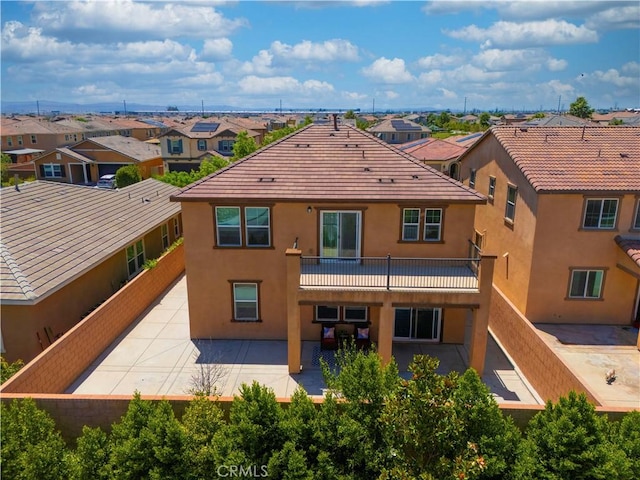 4733 S Rogers Way, Ontario, CA 91762 - rear view of house featuring stucco siding, a residential view, and a balcony