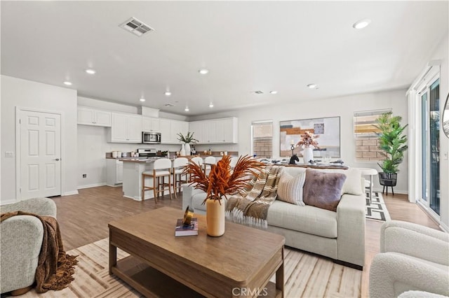 4733 S Rogers Way, Ontario, CA 91762 - living area with light wood-type flooring and recessed lighting