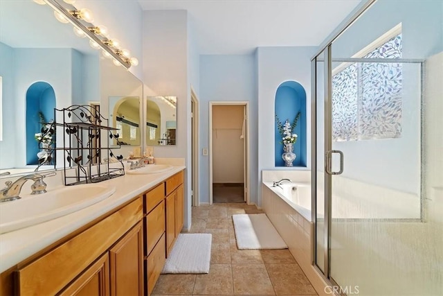 12744 Palmetto Ct, Riverside, CA 92503 - bathroom featuring a garden tub, double vanity, and a stall shower