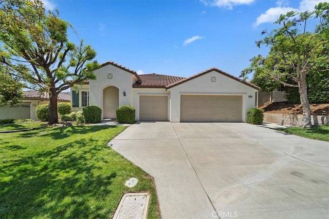 12744 Palmetto Ct, Riverside, CA 92503 - mediterranean / spanish-style home with an attached garage, stucco siding, a tile roof, driveway, and a front yard