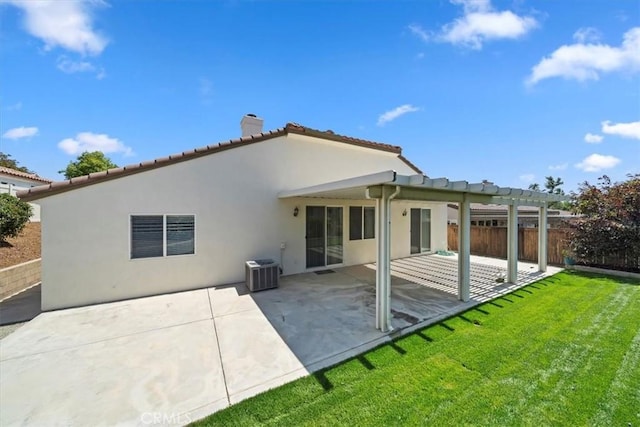 12744 Palmetto Ct, Riverside, CA 92503 - back of house with a chimney, stucco siding, a pergola, a patio, and a tiled roof