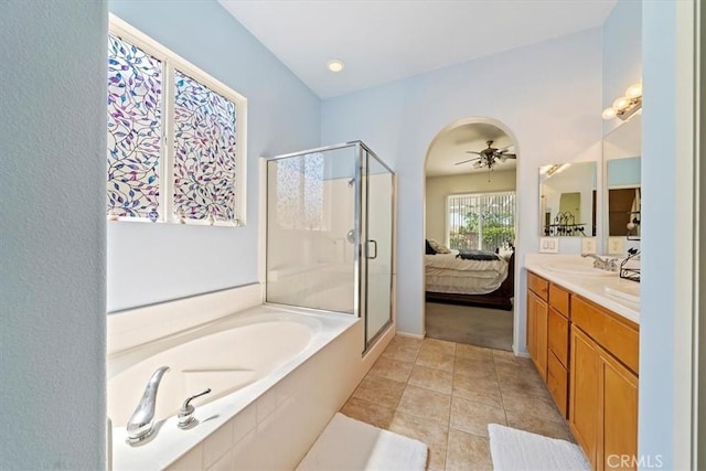 12744 Palmetto Ct, Riverside, CA 92503 - ensuite bathroom featuring a shower stall, a garden tub, ceiling fan, double vanity, and tile patterned floors