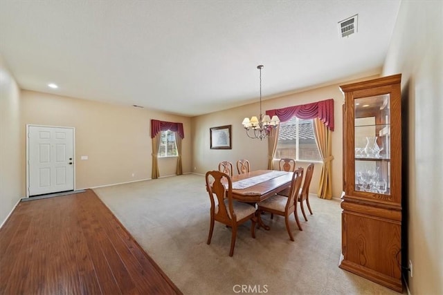 12744 Palmetto Ct, Riverside, CA 92503 - dining area with a chandelier and light wood finished floors