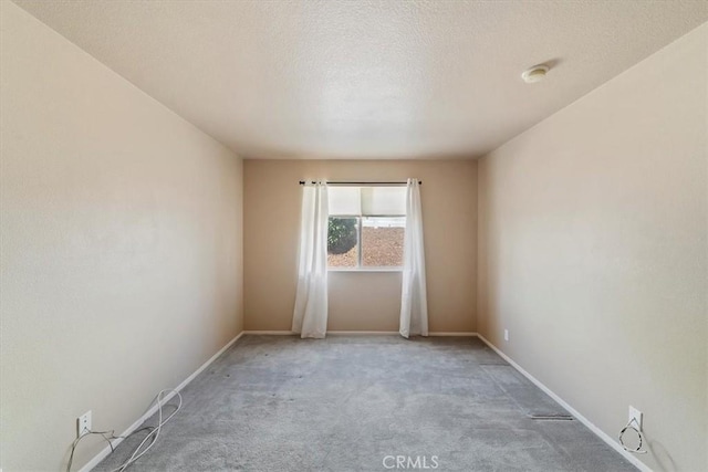 12744 Palmetto Ct, Riverside, CA 92503 - spare room featuring carpet floors and a textured ceiling