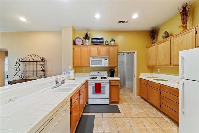 12744 Palmetto Ct, Riverside, CA 92503 - kitchen featuring white appliances, tile countertops, light tile patterned floors, recessed lighting, and a peninsula