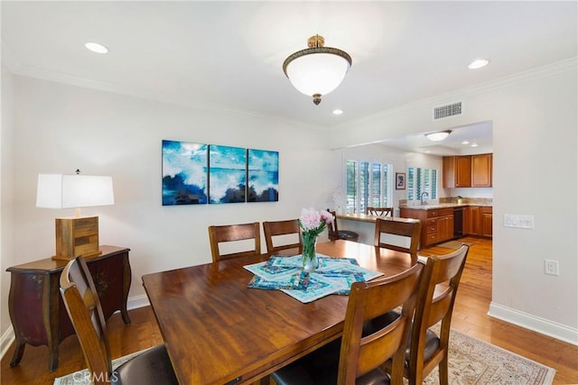 5185 Duenas, Laguna Woods, CA 92637 - dining area with ornamental molding, light wood-style floors, and recessed lighting