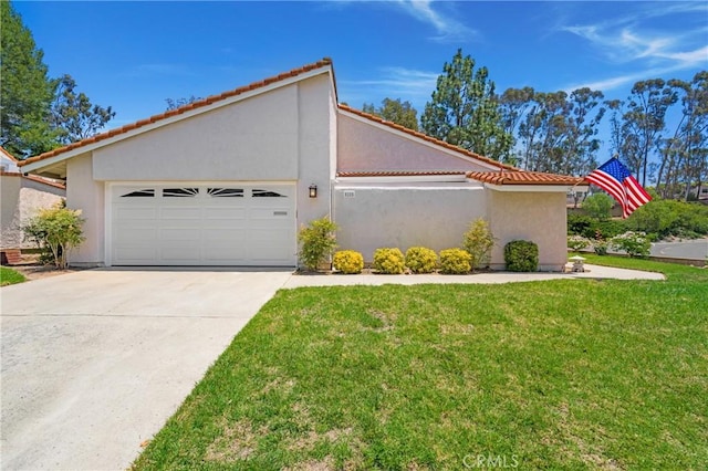 5185 Duenas, Laguna Woods, CA 92637 - view of front of property featuring an attached garage, concrete driveway, stucco siding, and a front lawn