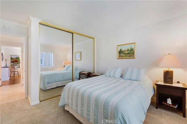 5185 Duenas, Laguna Woods, CA 92637 - bedroom with ornamental molding, light carpet, and a closet