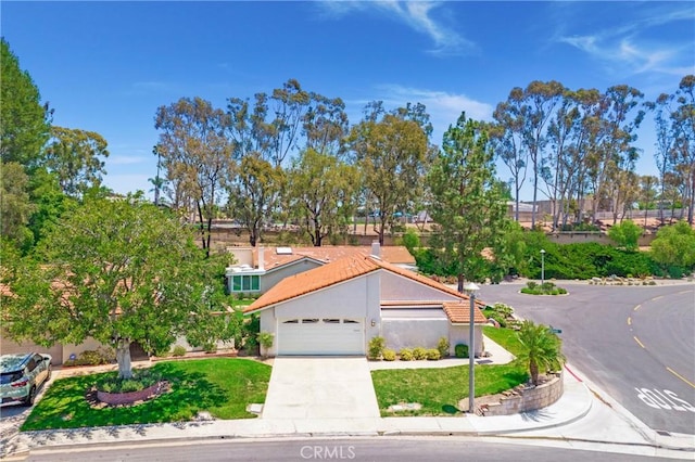 5185 Duenas, Laguna Woods, CA 92637 - view of front of house with a garage, driveway, and stucco siding