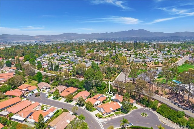 5185 Duenas, Laguna Woods, CA 92637 - aerial view of property's location with a mountainous background and nearby suburban area