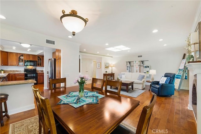 5185 Duenas, Laguna Woods, CA 92637 - dining space featuring light wood-style flooring, recessed lighting, and crown molding