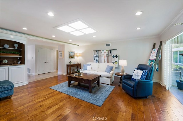 5185 Duenas, Laguna Woods, CA 92637 - living area with crown molding, light wood-style floors, and recessed lighting