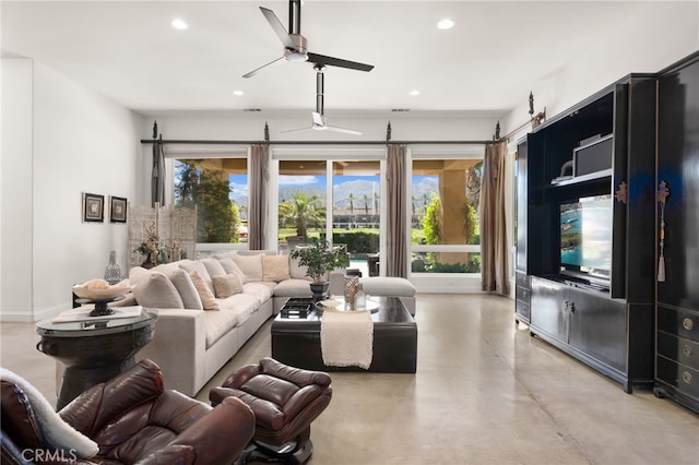 56102 Baltusrol Ln, Quinta, CA 92253 - living room with recessed lighting, ceiling fan, and finished concrete flooring