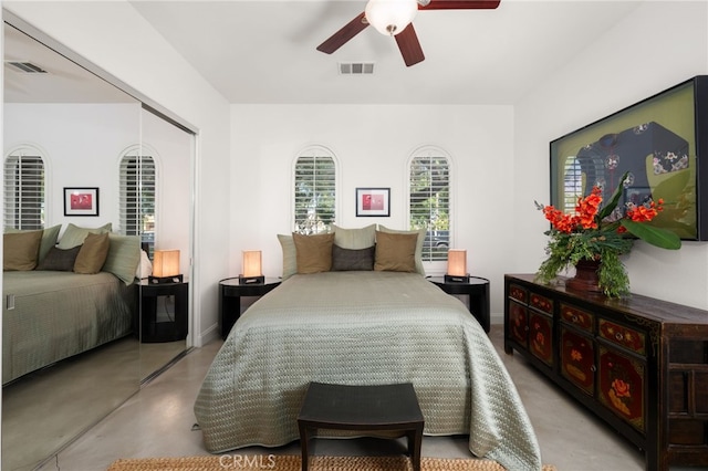 56102 Baltusrol Ln, Quinta, CA 92253 - bedroom featuring concrete floors, a ceiling fan, and a closet