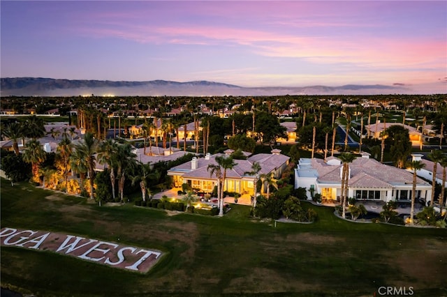56102 Baltusrol Ln, Quinta, CA 92253 - aerial view at dusk of a residential view and a mountain view