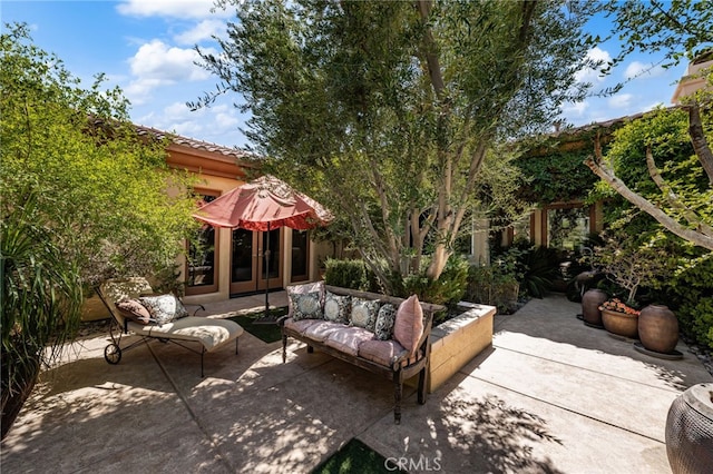 56102 Baltusrol Ln, Quinta, CA 92253 - view of patio featuring an outdoor hangout area and french doors