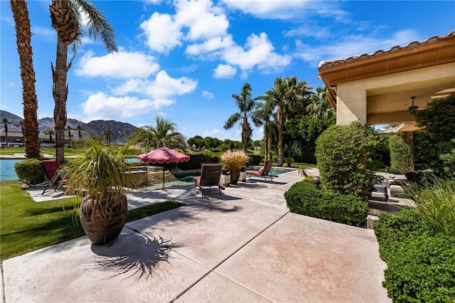 56102 Baltusrol Ln, Quinta, CA 92253 - view of patio / terrace featuring a mountain view and an outdoor pool