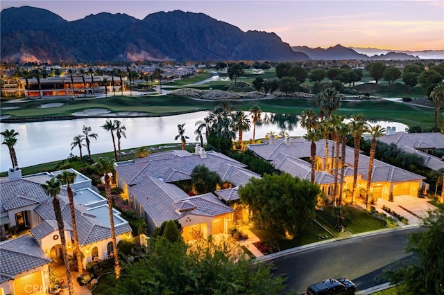 56102 Baltusrol Ln, Quinta, CA 92253 - aerial view at dusk of a water and mountain view, view of golf course, and a residential view