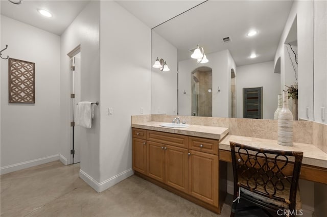 56102 Baltusrol Ln, Quinta, CA 92253 - full bath with a shower stall, vanity, finished concrete floors, and recessed lighting