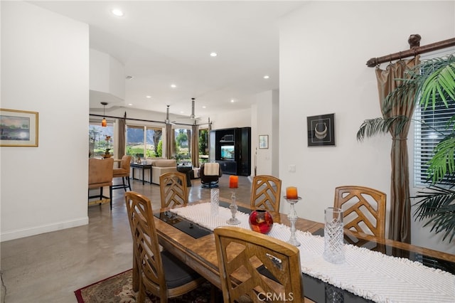 56102 Baltusrol Ln, Quinta, CA 92253 - dining room featuring finished concrete flooring and recessed lighting