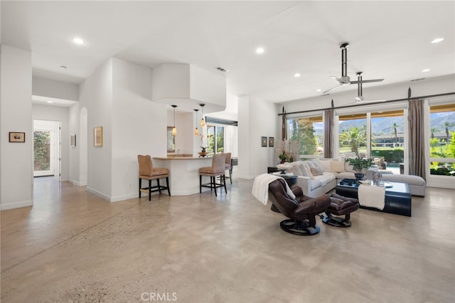 56102 Baltusrol Ln, Quinta, CA 92253 - living area featuring recessed lighting, arched walkways, and finished concrete floors
