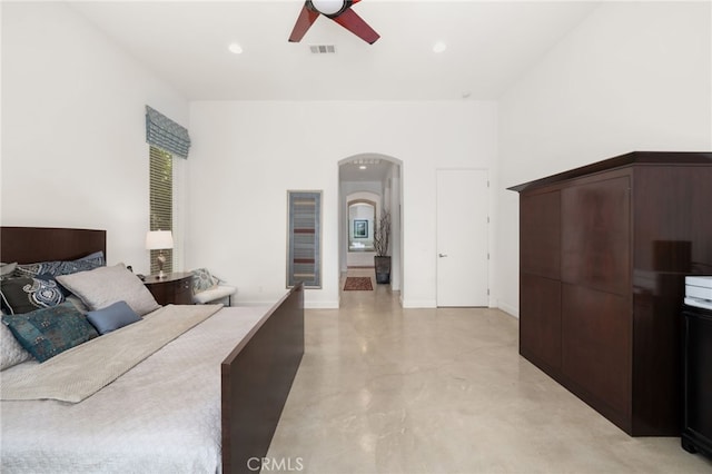 56102 Baltusrol Ln, Quinta, CA 92253 - bedroom featuring arched walkways, finished concrete flooring, a ceiling fan, and recessed lighting