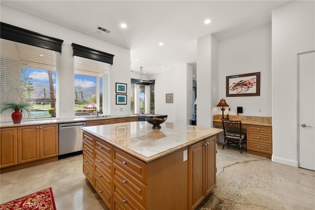 56102 Baltusrol Ln, Quinta, CA 92253 - kitchen with dishwasher, light stone countertops, a center island, recessed lighting, and built in desk