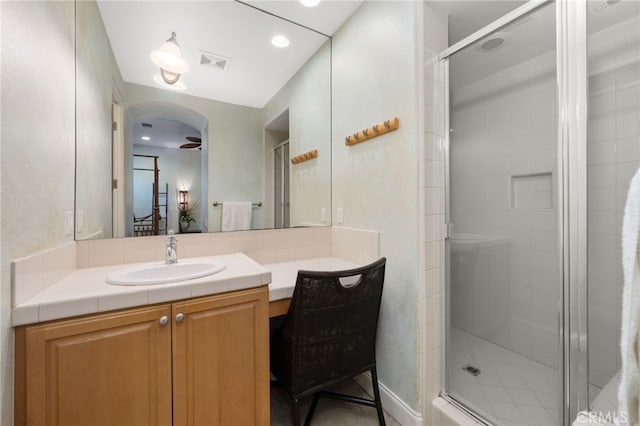 56102 Baltusrol Ln, Quinta, CA 92253 - bathroom featuring a stall shower, vanity, and recessed lighting