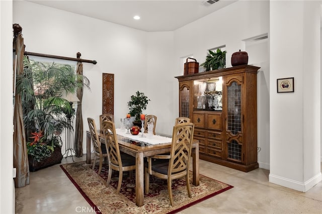 56102 Baltusrol Ln, Quinta, CA 92253 - dining room with finished concrete flooring and recessed lighting