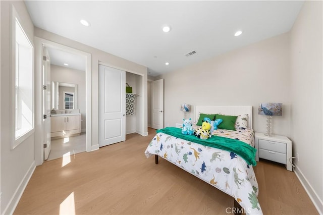390 Riverbend, Lake Forest, CA 92630 - bedroom featuring light wood-type flooring, recessed lighting, and a closet