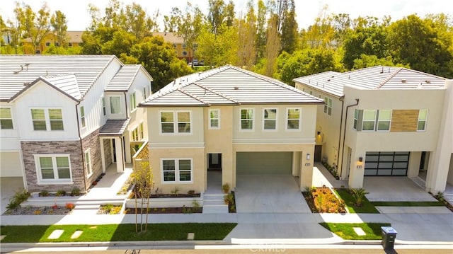 390 Riverbend, Lake Forest, CA 92630 - view of front of home with an attached garage, concrete driveway, a tile roof, and stucco siding