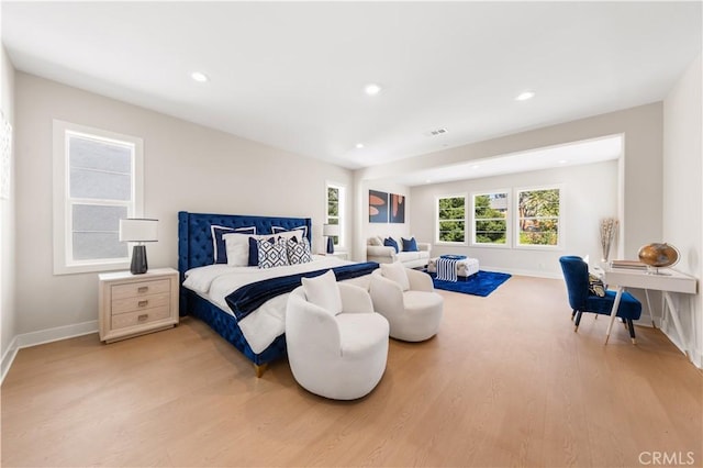 390 Riverbend, Lake Forest, CA 92630 - bedroom with light wood-style floors and recessed lighting