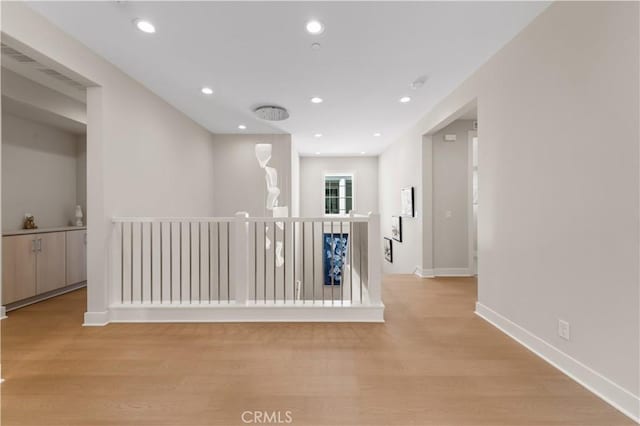 390 Riverbend, Lake Forest, CA 92630 - hallway with an upstairs landing, wood finished floors, and recessed lighting