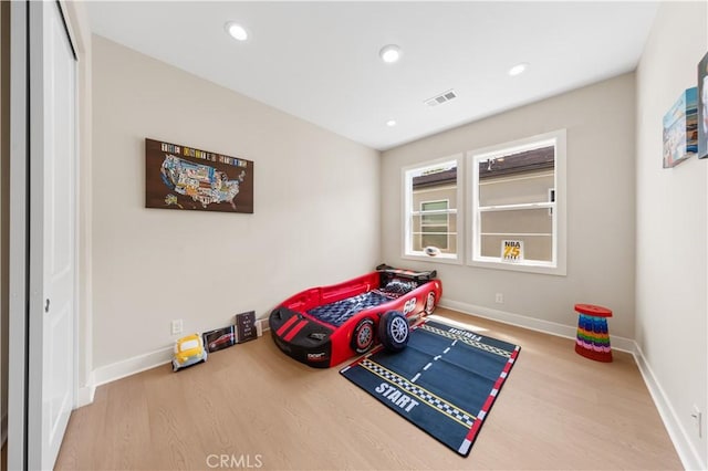 390 Riverbend, Lake Forest, CA 92630 - bedroom featuring wood finished floors, recessed lighting, and a closet