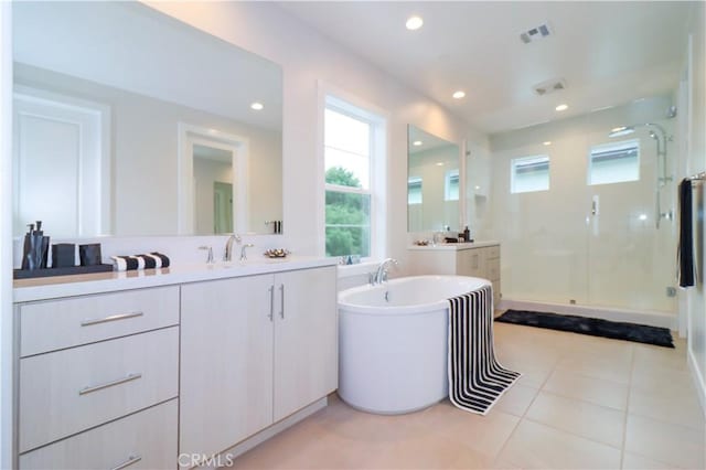 390 Riverbend, Lake Forest, CA 92630 - full bathroom with a shower stall, vanity, a freestanding bath, tile patterned flooring, and recessed lighting