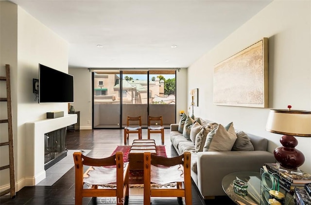 930 N Wetherly Dr Unit 201, West Hollywood, CA 90069 - living room featuring wood finished floors, a wall of windows, a fireplace with flush hearth, and recessed lighting