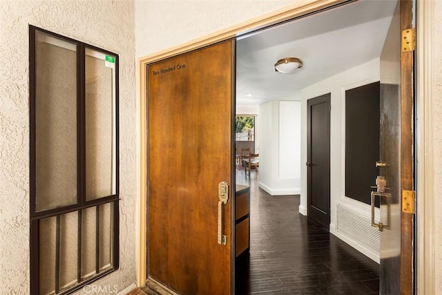 930 N Wetherly Dr Unit 201, West Hollywood, CA 90069 - corridor featuring dark wood-type flooring and a textured wall