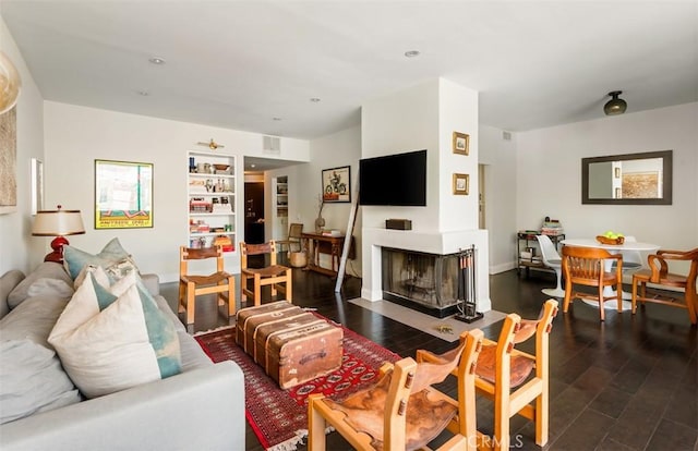 930 N Wetherly Dr Unit 201, West Hollywood, CA 90069 - living area with a multi sided fireplace, wood finished floors, and recessed lighting
