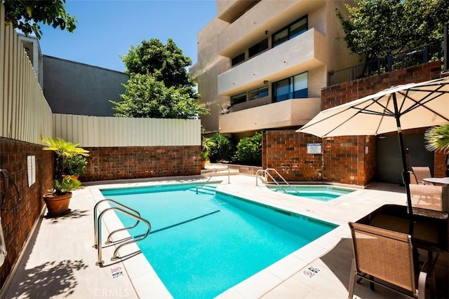 930 N Wetherly Dr Unit 201, West Hollywood, CA 90069 - community pool with a hot tub and a patio area