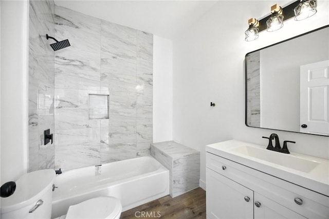 594 W 10th St, San Bernardino, CA 92410 - bathroom featuring vanity, wood finished floors, and shower / washtub combination