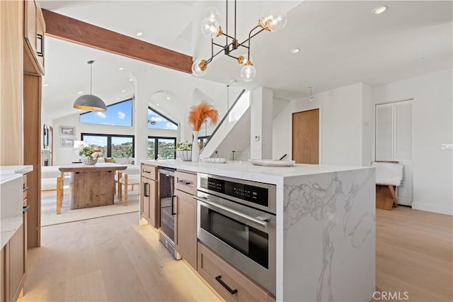 8280 Grand View Dr, Los Angeles, CA 90046 - kitchen featuring light wood finished floors, open floor plan, recessed lighting, a chandelier, and pendant lighting